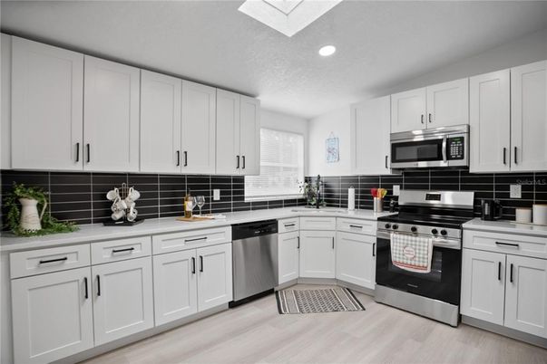 Interior, Kitchen, Recessed Lighting, Stainless Steel Appliances, Wood Texture Flooring