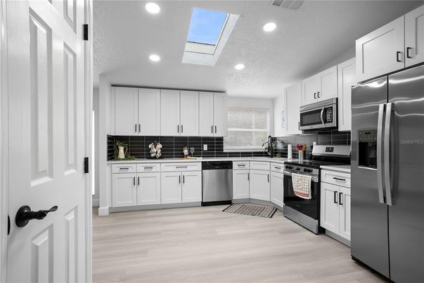 Interior, Kitchen, Recessed Lighting, Stainless Steel Appliances, Wood Texture Flooring