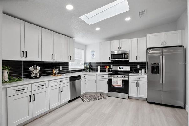 Interior, Kitchen, Recessed Lighting, Stainless Steel Appliances, Wood Texture Flooring