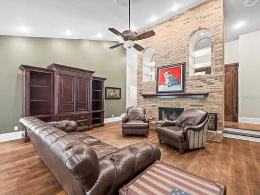 Fireplace, Interior, Living room, Recessed Lighting, Stone Walls, Wood Texture Flooring