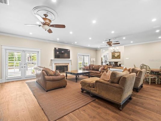 Dining room, Fireplace, Interior, Living room, Recessed Lighting, Wood Texture Flooring