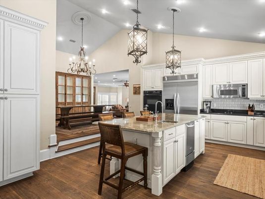 Chandelier, Interior, Kitchen, Living room, Pendant Lights, Recessed Lighting, Stainless Steel Appliances, Wood Texture Flooring
