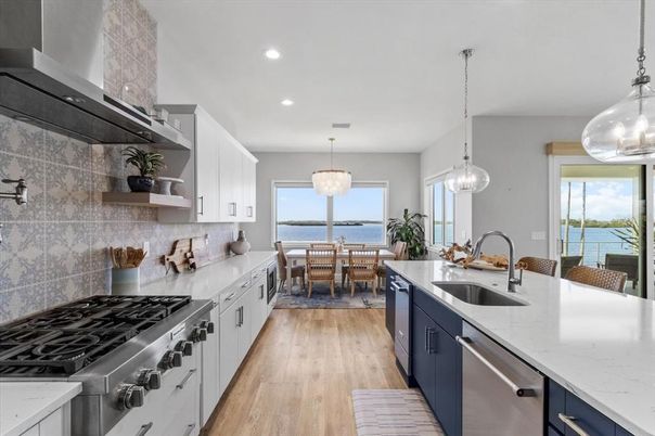 Dining room, Interior, Kitchen, Pendant Lights, Recessed Lighting, Stainless Steel Appliances, Water, Wood Texture Flooring