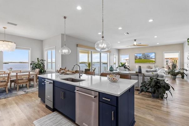Dining room, Interior, Kitchen, Living room, Pendant Lights, Recessed Lighting, Stainless Steel Appliances, Water, Wood Texture Flooring