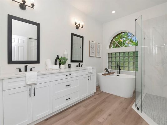 Bathroom, Dual Sink Vanities, Free Standing Baths, Glass Shower, Interior, Recessed Lighting, Wood Texture Flooring