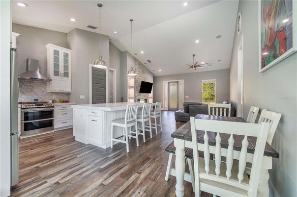Dining room, Interior, Kitchen, Pendant Lights, Recessed Lighting, Stainless Steel Appliances, Wood Texture Flooring