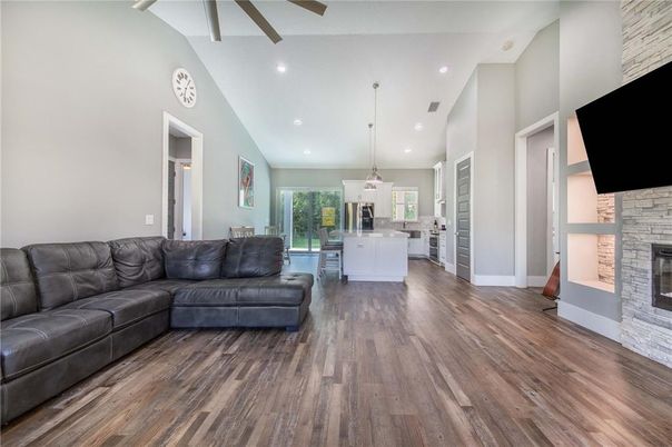 Fireplace, Interior, Kitchen, Living room, Pendant Lights, Recessed Lighting, Stone Walls, Wood Texture Flooring