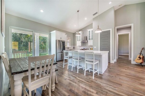 Dining room, Interior, Kitchen, Pendant Lights, Recessed Lighting, Stainless Steel Appliances, Wood Texture Flooring