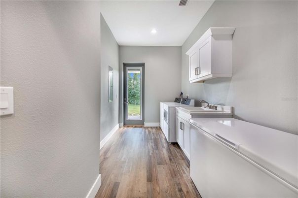 Interior, Kitchen, Recessed Lighting, Washer, Wood Texture Flooring
