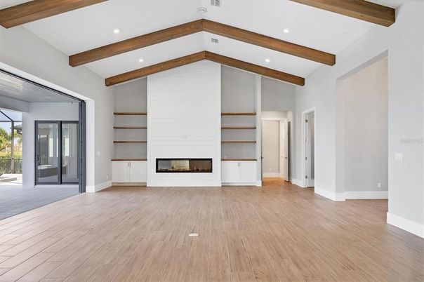 Empty room, Fireplace, Interior, Recessed Lighting, Wooden Beams, Wood Texture Flooring