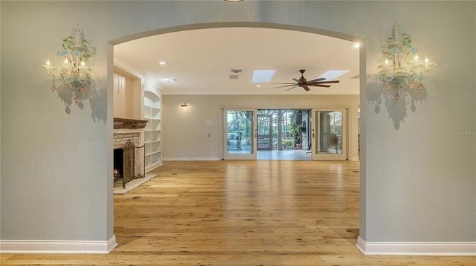 Chandelier, Empty room, Fireplace, Interior, Recessed Lighting, Wood Texture Flooring