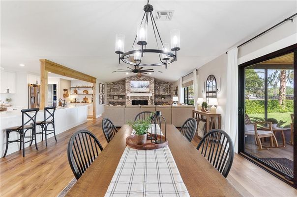 Chandelier, Dining room, Fireplace, Interior, Kitchen, Living room, Pendant Lights, Recessed Lighting, Stone Walls, Wood Texture Flooring