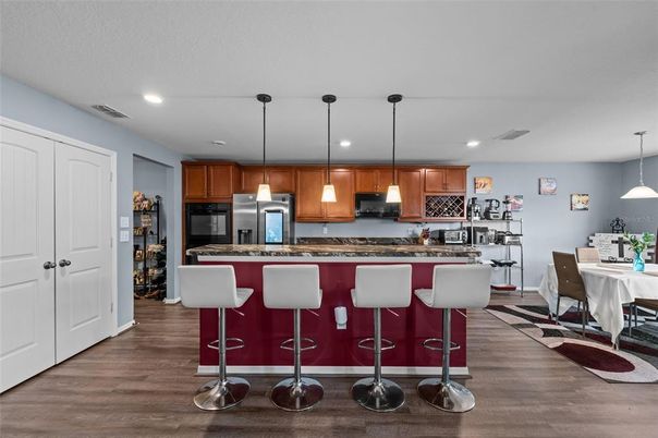 Dining room, Interior, Kitchen, Pendant Lights, Recessed Lighting, Stainless Steel Appliances, Wood Texture Flooring