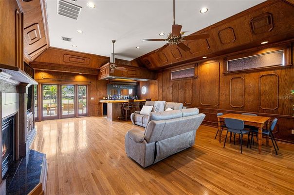 Dining room, Fireplace, Interior, Living room, Pendant Lights, Recessed Lighting, Wood Texture Flooring, Wooden Walls