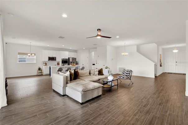 Chandelier, Interior, Kitchen, Living room, Pendant Lights, Recessed Lighting, Stainless Steel Appliances, Wood Texture Flooring