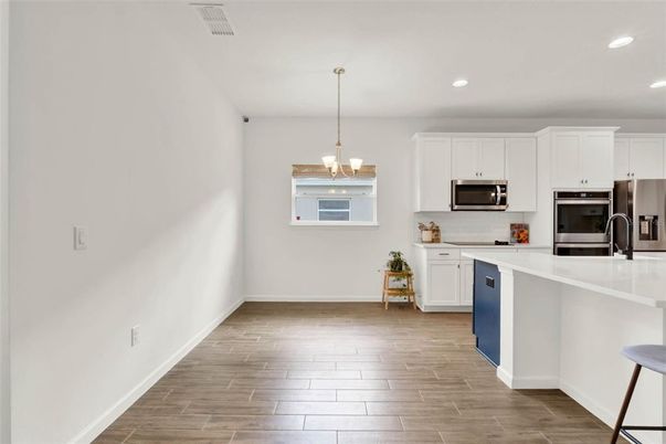 Chandelier, Interior, Kitchen, Recessed Lighting, Stainless Steel Appliances, Wood Texture Flooring
