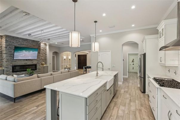 Fireplace, Interior, Kitchen, Living room, Pendant Lights, Recessed Lighting, Stone Walls, Wood Texture Flooring