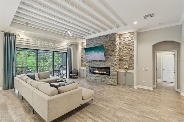 Fireplace, Interior, Living room, Recessed Lighting, Stone Walls, Wood Texture Flooring