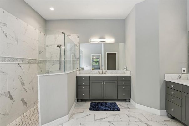 Bathroom, Dual Sink Vanities, Glass Shower, Interior, Marble, Marble Walls, Recessed Lighting