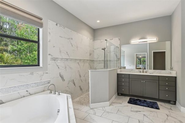 Bathroom, Dual Sink Vanities, Free Standing Baths, Glass Shower, Interior, Marble, Marble Walls, Recessed Lighting