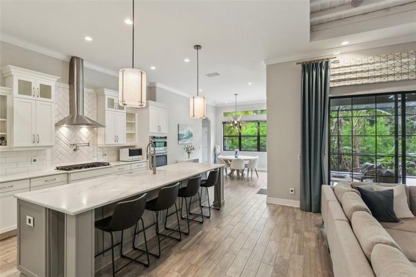 Dining room, Interior, Kitchen, Living room, Pendant Lights, Recessed Lighting, Stainless Steel Appliances, Wood Texture Flooring