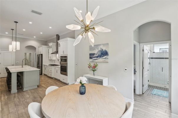 Dining room, Interior, Kitchen, Pendant Lights, Recessed Lighting, Stainless Steel Appliances, Wood Texture Flooring