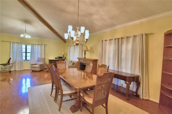 Chandelier, Dining room, Fireplace, Interior, Living room, Pendant Lights, Wooden Beams, Wood Texture Flooring