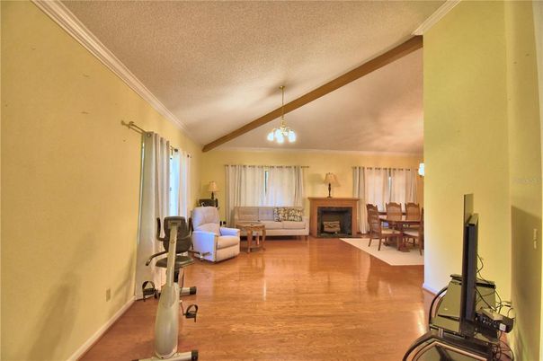 Dining room, Fireplace, Interior, Living room, Pendant Lights, Wooden Beams, Wood Texture Flooring