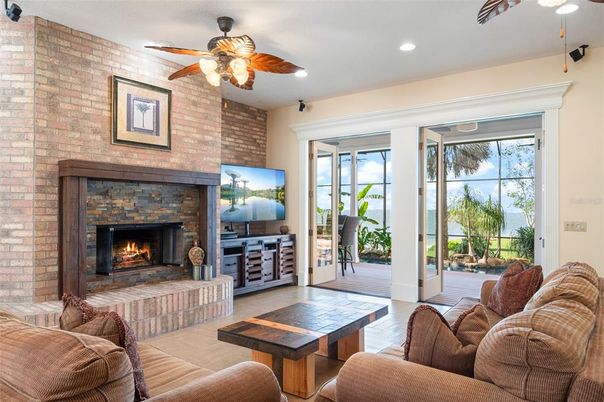 Fireplace, Interior, Living room, Recessed Lighting, Stone Walls, Wood Texture Flooring