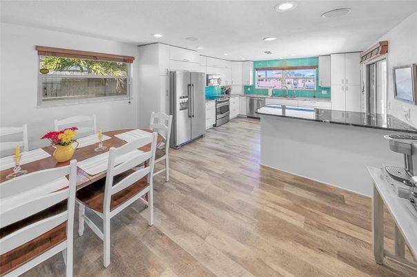 Dining room, Interior, Kitchen, Recessed Lighting, Stainless Steel Appliances, Wood Texture Flooring