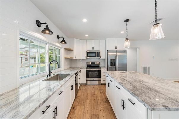 Interior, Kitchen, Pendant Lights, Recessed Lighting, Stainless Steel Appliances, Wood Texture Flooring
