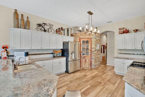 Interior, Kitchen, Pendant Lights, Stainless Steel Appliances, Stone Walls, Wood Texture Flooring