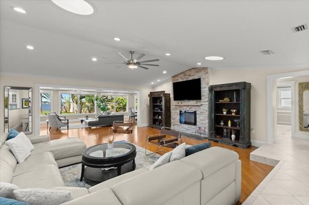 Fireplace, Interior, Living room, Recessed Lighting, Stone Walls, Wood Texture Flooring