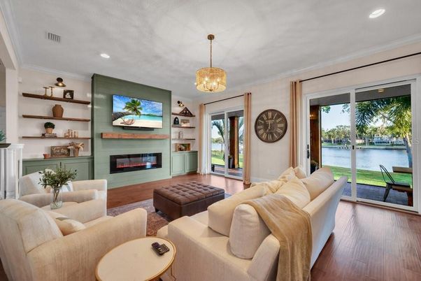 Fireplace, Interior, Living room, Pendant Lights, Recessed Lighting, Water, Wood Texture Flooring