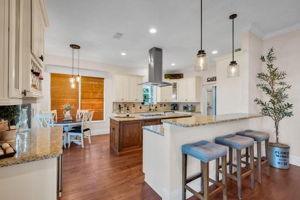 Dining room, Interior, Kitchen, Pendant Lights, Recessed Lighting, Stainless Steel Appliances, Wood Texture Flooring