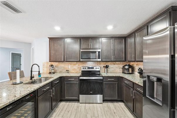 Interior, Kitchen, Recessed Lighting, Stainless Steel Appliances, Wood Texture Flooring