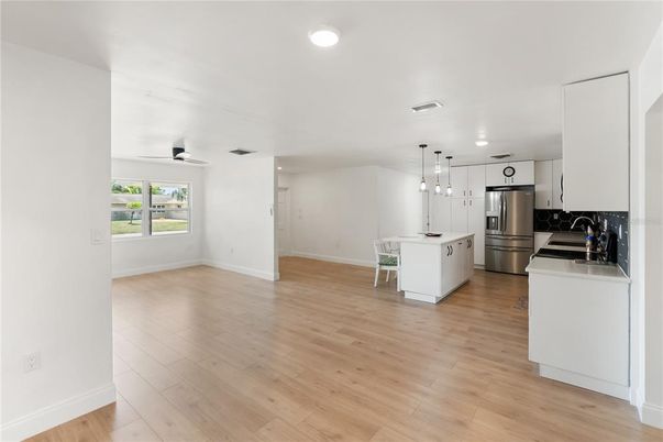 Dining room, Interior, Kitchen, Pendant Lights, Recessed Lighting, Stainless Steel Appliances, Wood Texture Flooring