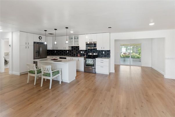 Interior, Kitchen, Pendant Lights, Recessed Lighting, Stainless Steel Appliances, Wood Texture Flooring
