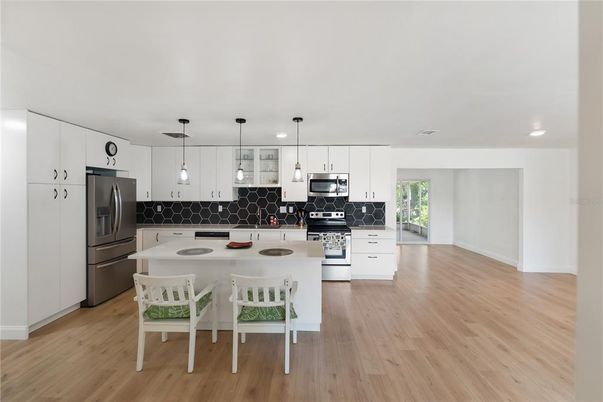 Interior, Kitchen, Pendant Lights, Recessed Lighting, Stainless Steel Appliances, Wood Texture Flooring