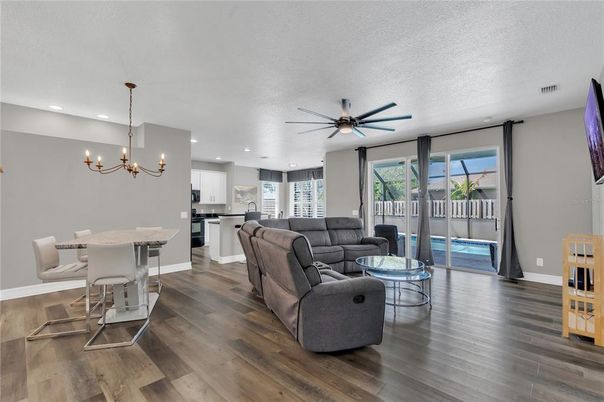 Chandelier, Dining room, Interior, Kitchen, Living room, Pendant Lights, Recessed Lighting, Wood Texture Flooring
