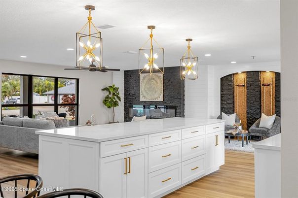 Fireplace, Interior, Living room, Pendant Lights, Recessed Lighting, Stone Walls, Wood Texture Flooring