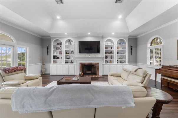 Fireplace, Interior, Living room, Piano, Recessed Lighting, Wood Texture Flooring