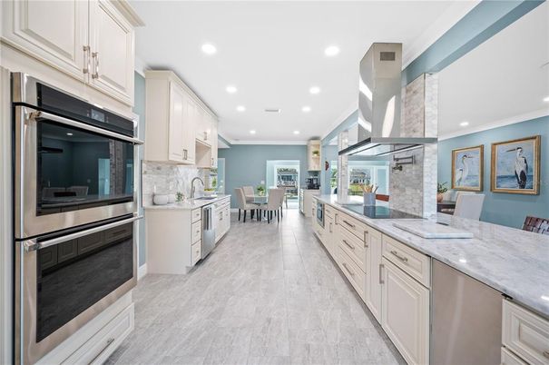 Dining room, Interior, Kitchen, Recessed Lighting, Stainless Steel Appliances, Wood Texture Flooring
