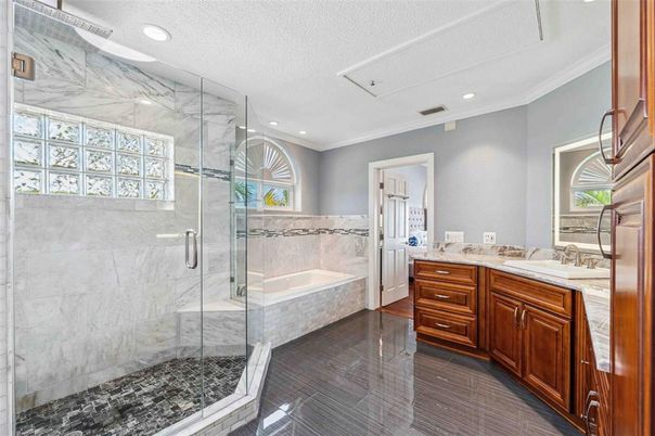 Bathroom, Dual Sink Vanities, Glass Shower, Interior, Marble Walls, Recessed Lighting