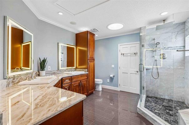Bathroom, Dual Sink Vanities, Glass Shower, Interior, Marble Walls, Recessed Lighting