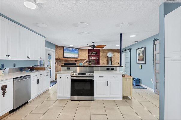Interior, Kitchen, Recessed Lighting, Stainless Steel Appliances, Stone Walls