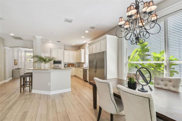 Chandelier, Dining room, Interior, Kitchen, Recessed Lighting, Stainless Steel Appliances, Wood Texture Flooring