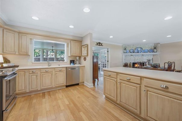 Fireplace, Interior, Kitchen, Recessed Lighting, Stainless Steel Appliances, Wood Texture Flooring