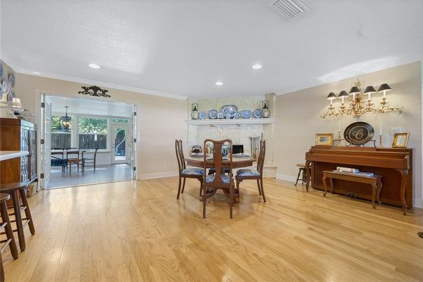 Dining room, Fireplace, Interior, Piano, Recessed Lighting, Wood Texture Flooring