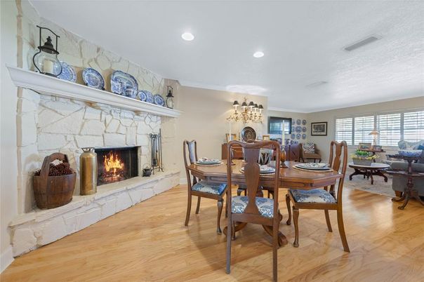 Dining room, Fireplace, Interior, Living room, Recessed Lighting, Wood Texture Flooring